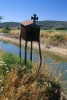 A roadside religious rusted metal shrine with cross in the Greek countryside. To purchase this image, please go to my stock agency click here.