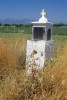 A roadside concrete religious shrine with cross in the Greek countryside. To purchase this image, please go to my stock agency click here.
