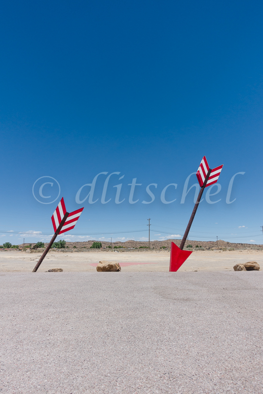 Huge twin arrows on the roadside of Interstate 40 in Northern Arizona.