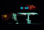 A n oldtime Mobil gas station in California at night.