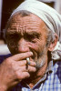Siberian  adult male wearing headscarf with cigarette, Krasnoyarsk Krai region of Siberia. To purchase this image, please go to my stock agency click here.