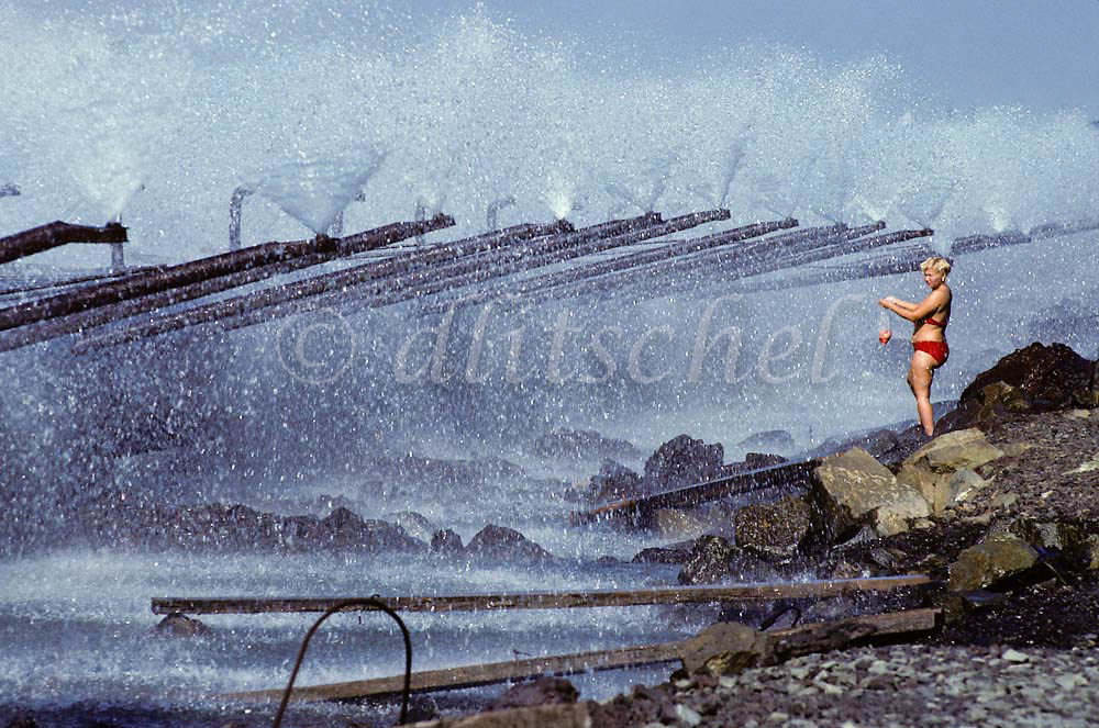 Siberian woman cooling off during heat wave in mining center of Norilsk, Siberia. The city is located 300 kilometers above the Arctic Circle. To purchase this image, please go to my stock agency click here.
