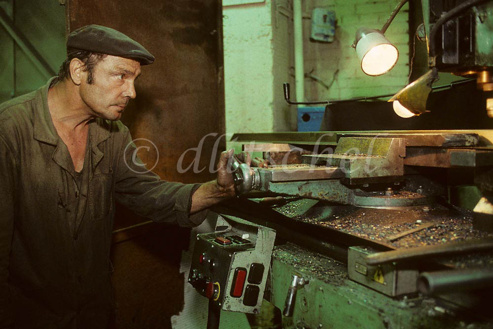 Siberian machinist at work in the city of Krasnoyarsk at the convergence of the Trans Siberian Railway and the Yenisei River.  To purchase this image, please go to my stock agency click here.