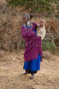 A Masai woman holds her young child on her side in a Masai village in the Sinya area of northern Tanzania. To purchase this image, please go to my stock agency click here.