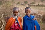 Two Masai women in traditional dress with a child in a village in the Sinya area of northern Tanzania. To purchase this image, please go to my stock agency click here.