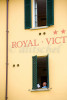 A man is seen reading in his hotel window at the Royal Victorian Hotel in the Lake Como village of Varenna Italy. To purchase this image, please go to my stock agency click here.