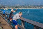 Three brothers fishing off of Stearn's Wharf 
