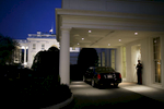 A United States Marine stands guard at the diplomatic entrance of the West Wing, near German Chancellor Angela Merkel's limousine.    Merkel was meeting with President Bush in the Oval Office at the White House in Washington Thursday, Jan. 4, 2007.Photo by Brooks Kraft/Corbis