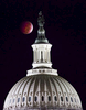 A full total lunar eclipse of the moon is visible over the dome of the United States Capitol in Washington.  A {quote}blood moon{quote} occurs when the earth positions itself between the sun and the moon, creating a full lunar eclipse with a majestic red hue. 