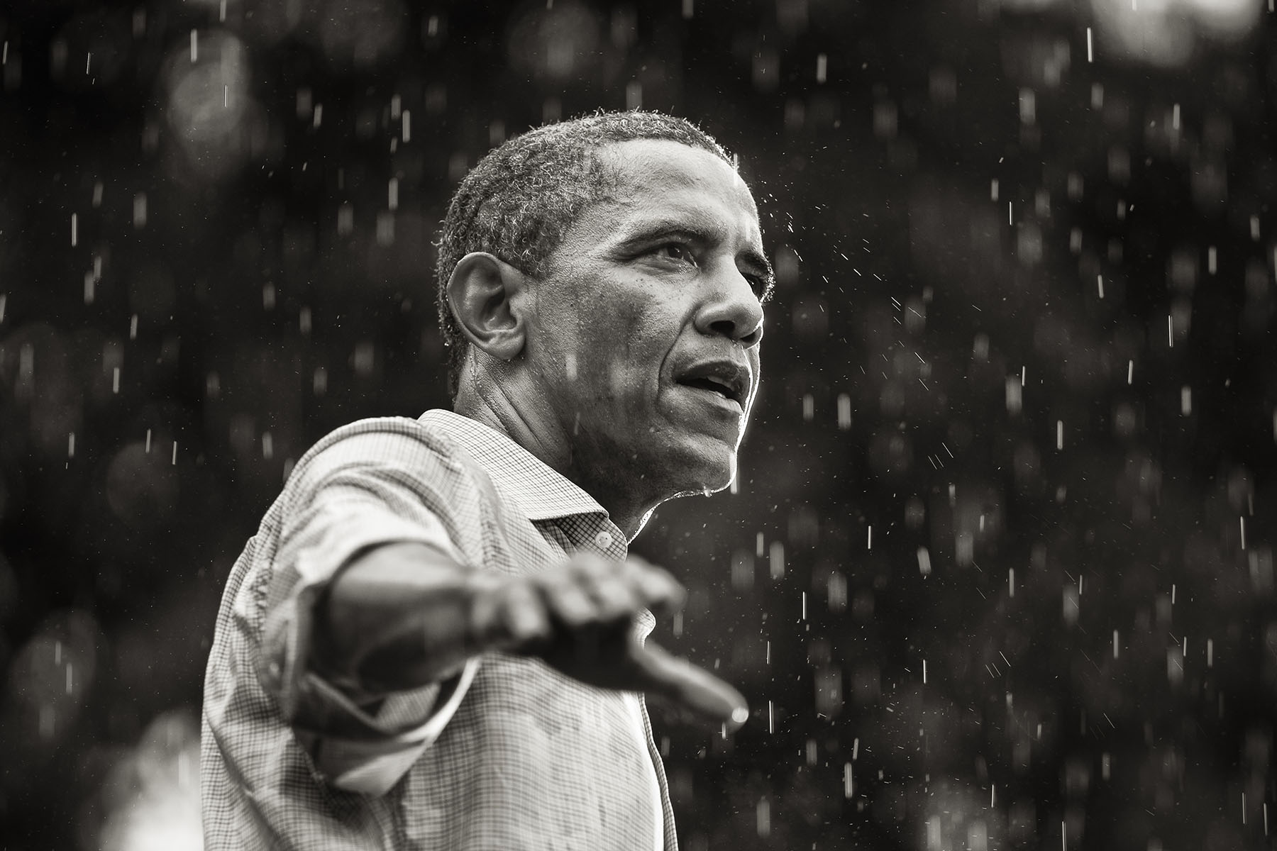 U.S. President Barack Obama speaks in the rain during a campaign rally in Glen Allen, Virginia