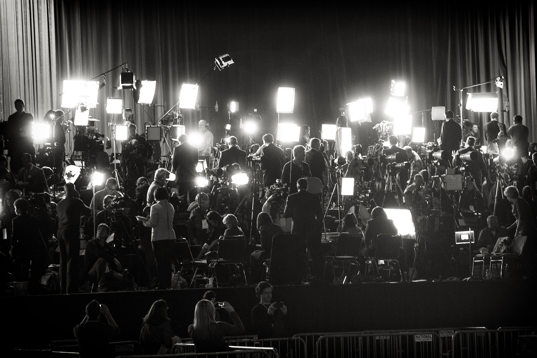A large media group awaits U.S. President Barack Obama before his election night rally in Chicago.