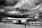 Storm clouds loom overhead as Air Force One and U.S. President George W. Bush arrive in Paris.