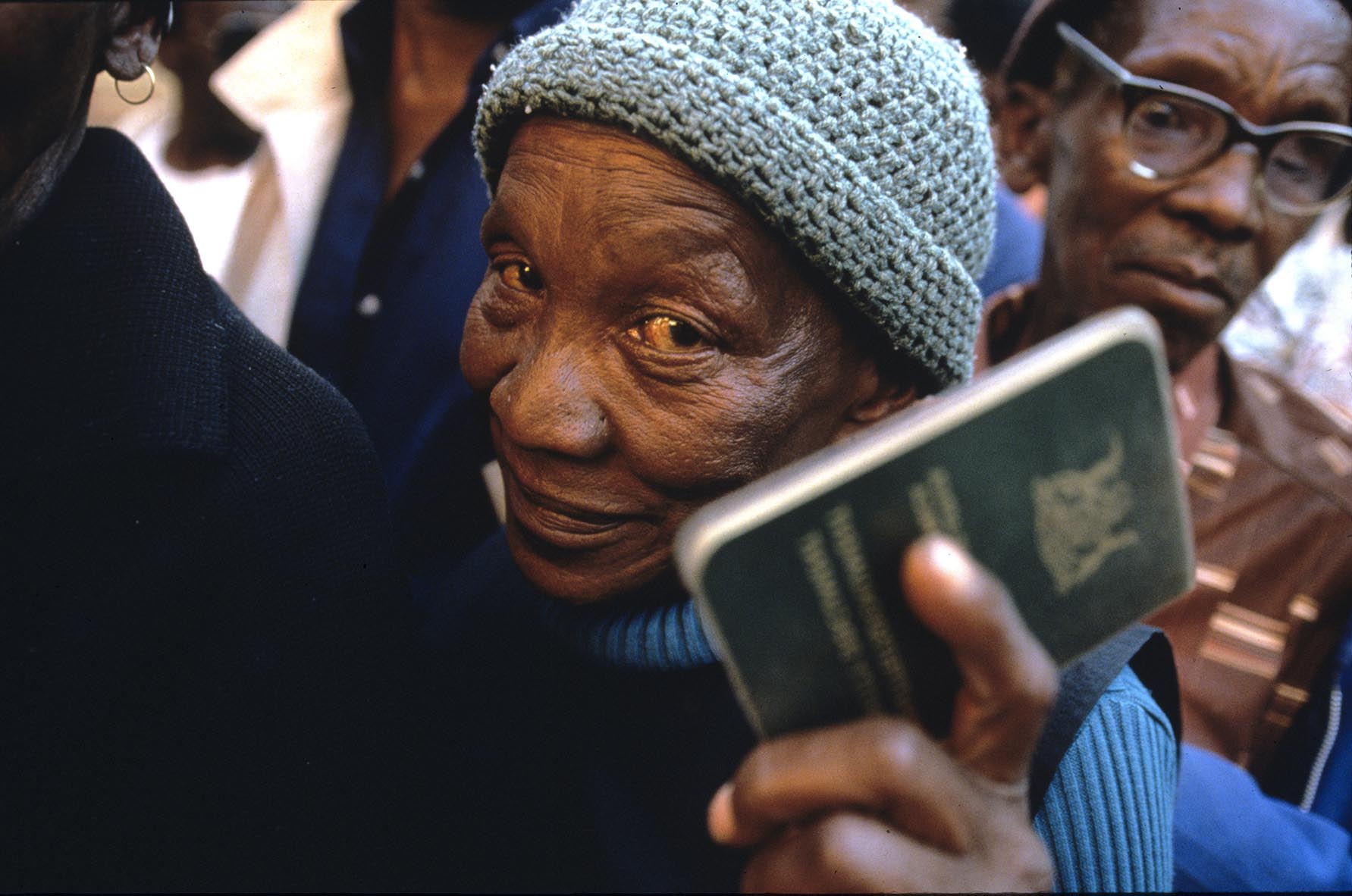 A woman holds her identity papers before casting her ballot at a polling station in Soweto.    Millions of South Africans voted in the nation's first free and democratic general election,  marking the end of centuries of apartheid rule.  Nelson Mandela of the African National Congress (ANC) was elected as the first black President of South Africa.