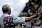 Nelson Mandela speaks to supporters at a campaign event.  After more then 27 years in jail as an anti-apartheid activist,   Nelson Mandela lead a 1994 campaign for President as a member of the African National Congress (ANC),  in the first free elections in South Africa in 1994.  Mandela has received more than 250 awards over four decades, including the 1993 Nobel Peace Prize.