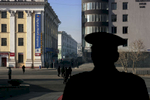 A Soldier from the Mongolian Army watches outside the Government House as preparation were underway for U.S. President George W. Bush's visit, Monday, Nov. 21, 2005 in Ulan Bator, Mongolia.Photo by Brooks Kraft/Corbis