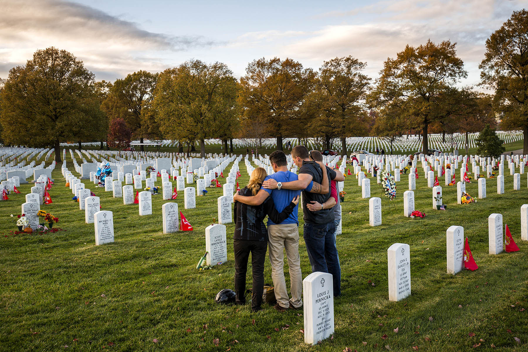 On Veterans Day a group gathers at a grave site of a loved one in Section 60 of Arlington National Cemetery.    Section 60 is a 14-acre plot that where over 1,000 people killed in the recent wars of Iraq and Afghanistan are buried.   