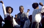 Nelson Mandela dances with school children at a campaign event. After more then 27 years in jail as an anti-apartheid activist,   Nelson Mandela lead a 1994 campaign for President as a member of the African National Congress (ANC),  in the first free elections in South Africa in 1994.  Mandela has received more than 250 awards over four decades, including the 1993 Nobel Peace Prize.