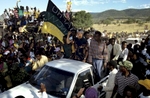 Nelson Mandela greets supports at a campaign stop. After more then 27 years in jail as an anti-apartheid activist,   Nelson Mandela lead a 1994 campaign for President as a member of the African National Congress (ANC),  in the first free elections in South Africa in 1994.  Mandela has received more than 250 awards over four decades, including the 1993 Nobel Peace Prize.