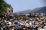 Crowds listen to Nelson Mandela at a campaign event.  After more then 27 years in jail as an anti-apartheid activist,   Nelson Mandela lead a 1994 campaign for President as a member of the African National Congress (ANC),  in the first free elections in South Africa in 1994.  Mandela has received more than 250 awards over four decades, including the 1993 Nobel Peace Prize.