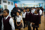 Archbishop Timothy Dolan is overjoyed with the children while taking a tour of the Mount Carmel- Holy Rosary school.