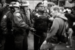 A police officer shoves a protester for not backing up quick enough Thursday in Zuccotti Park.