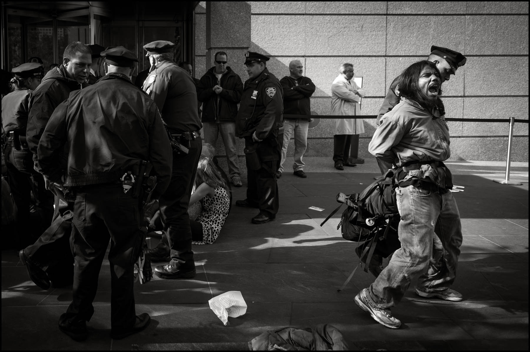 Occupy Wall Street protesters get arrested in front of Goldman Sachs headquarters in Battery Park City after they held a mock trial against the company at Zuccoti Park and marched to the building with their guilty verdict. Approximately 15-20 protesters were arrested in an act of civil disobedience.