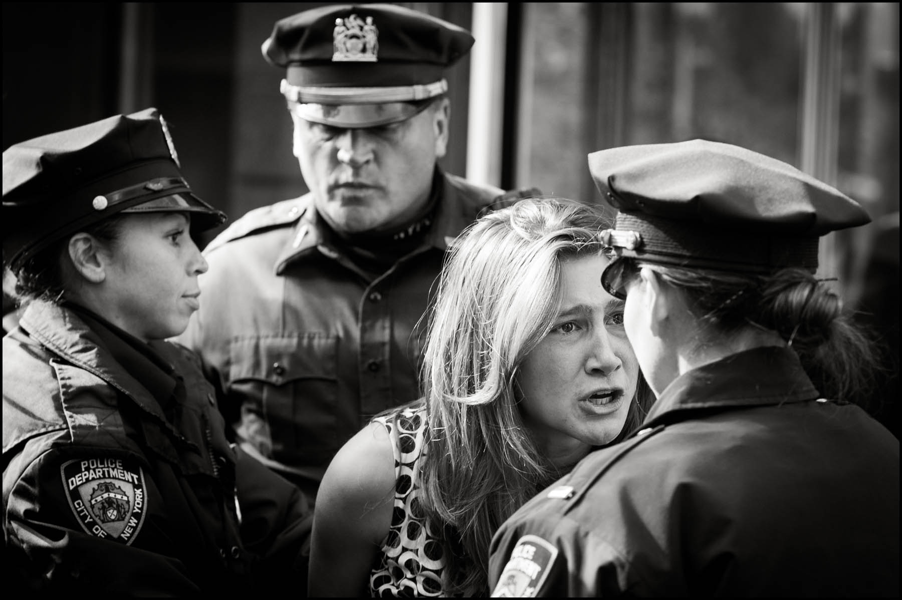 A young girl pleads with police as a group of Occupy Wall Street protesters get arrested in front of Goldman Sachs headquarters in Battery Park City after they held a mock trial against the company.
