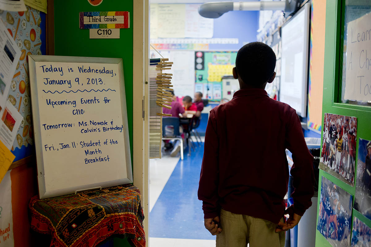 A student prepares to enter his classroom at the University of Chicago North Kenwood/Oakland Charter School.