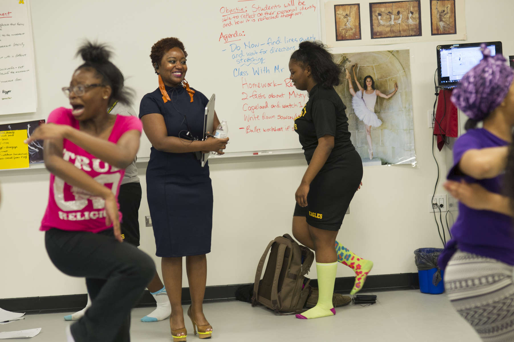 Principal Beulah McLoyd watches students move through a routine during a dance class at Dyett High School for the Arts, October 26, 2016.