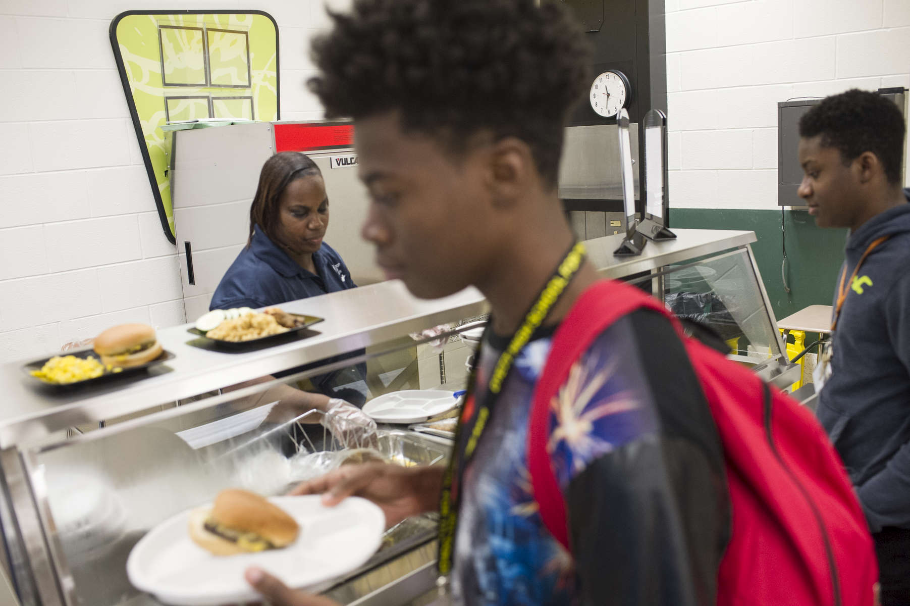 School cook Chandra Kilgore serves lunch at Dyett High School for the Arts, October 26, 2016.