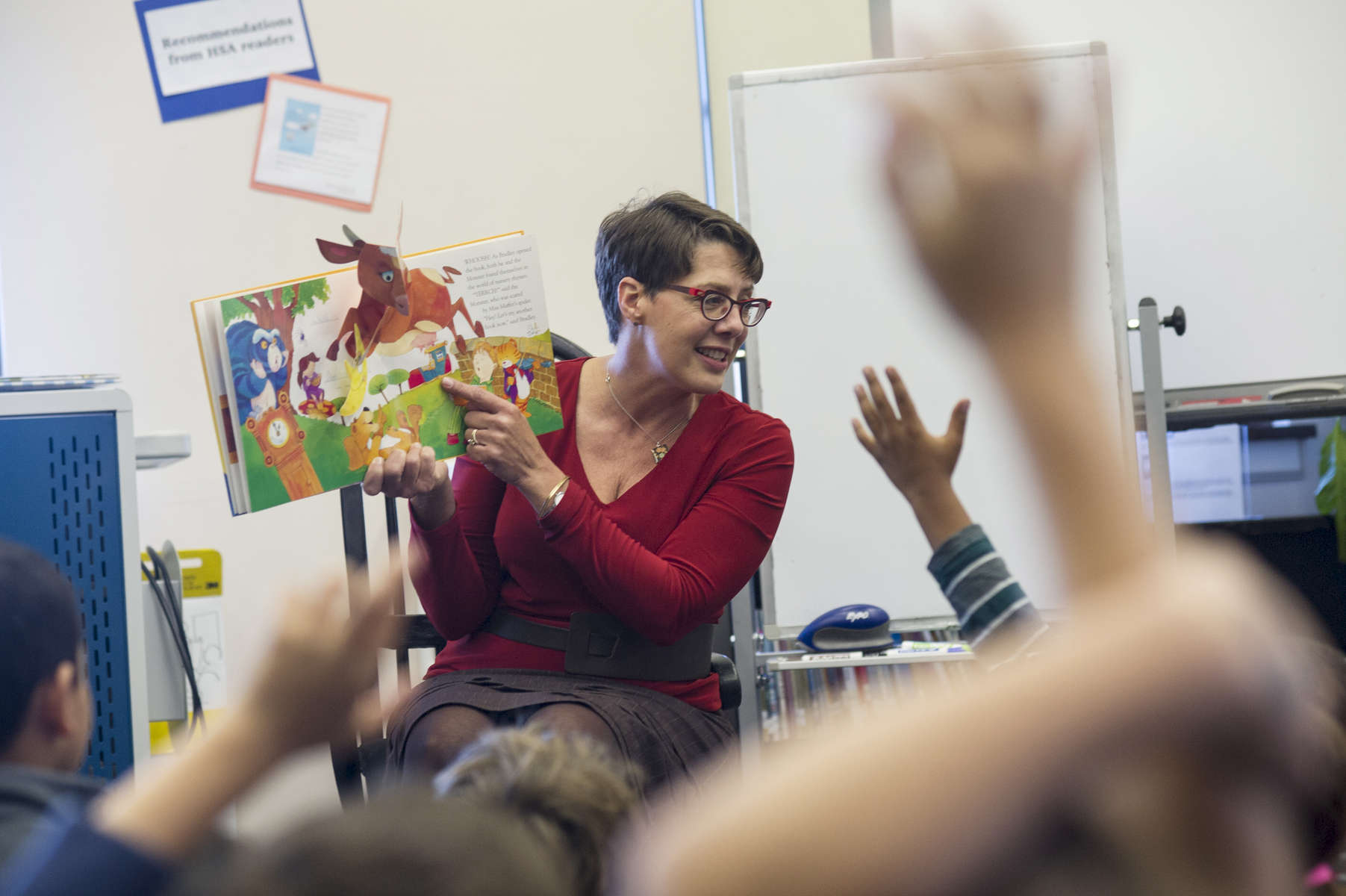 Librarian Lies Garner asks a group of first grade students if they recognize any characters or scenes from nursery rhymes in the book she is reading during their homeroom's library class at Hawthorne Scholastic Academy in Chicago's Lakeview neighborhood, November 10 2016.