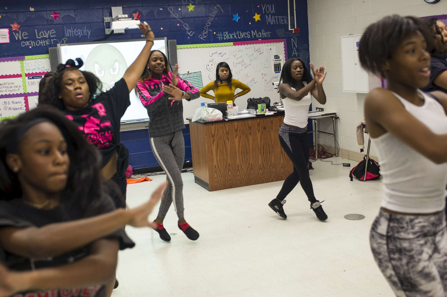 Biology teacher Kyera Bradley meets with the school's dance team in her room after school as they practice some routines at Noble Charter Schools - Johnson College Prep, November 8, 2016.