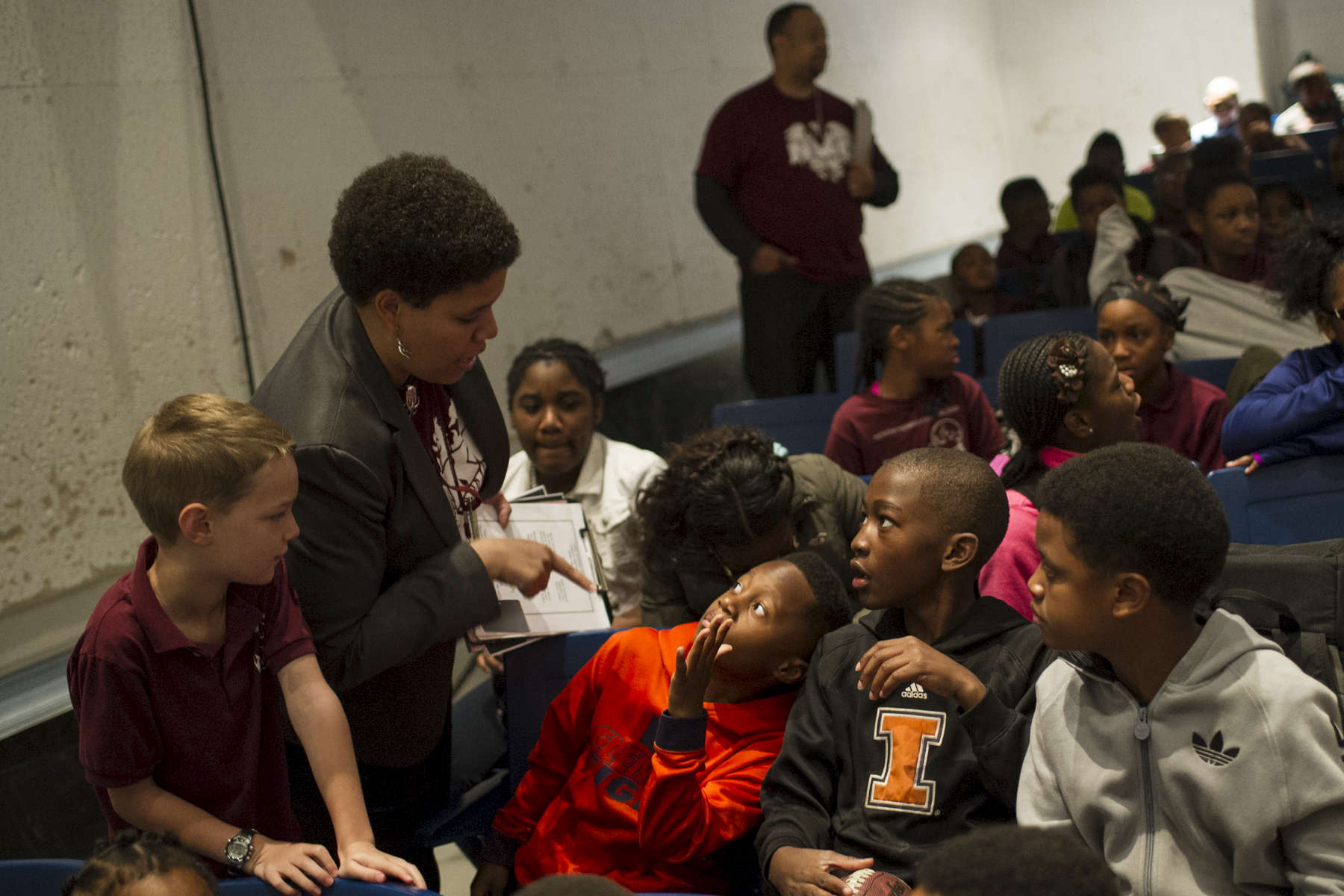 First year teacher Mel Georgiou copies quiets some of her fifth grade students down before an assembly at the University of Chicago Charter Schools North Kenwood Oakland Campus in the October 13, 2016.