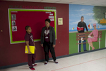 First year teacher Mel Georgiou has a hallway chat with a fifth grade student who was behaving inappropriately during a transition to class at the University of Chicago Charter Schools North Kenwood Oakland Campus, November 13, 2016.