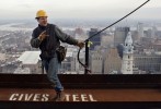 Ironworker prepares to move a beam on the 46th floor of the Comcast Center.