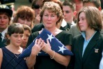 Funeral service for Victor Saracini, pilot of United Flight 175, which struck the World Trade Center. Widow Ellen Saracini holds the American flag as her daughters Brielle 10 (left) and Kirsten 13 stand by her side.