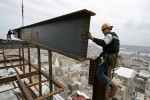 Ironworkers prepare to connect a perimeter beam on the 57th floor of the Comcast Center. Here they are working approximately 876 feet above street level.