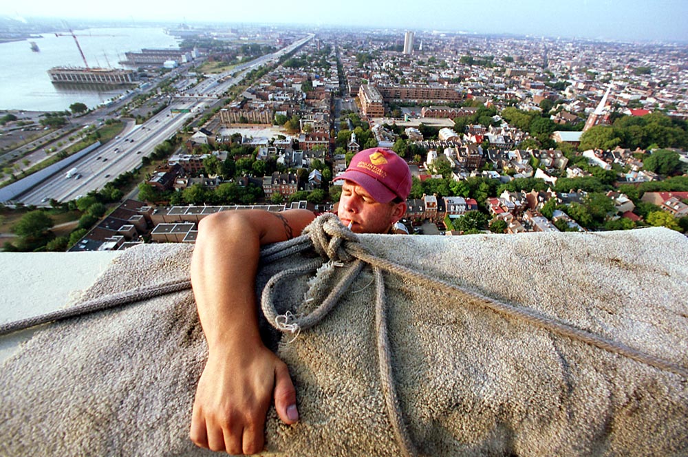 John Acevedo, 20, settles into his chair before descending from the roof of the 32-story Society Hill Towers.
