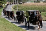 An Amish funeral procession moves along Mine Road towards Bart Cemetery, after the service of Naomi Rose Ebersol, the first of three services for four of the victims in Bart Township, Lancaster County, Pa. on October 5, 2006. 