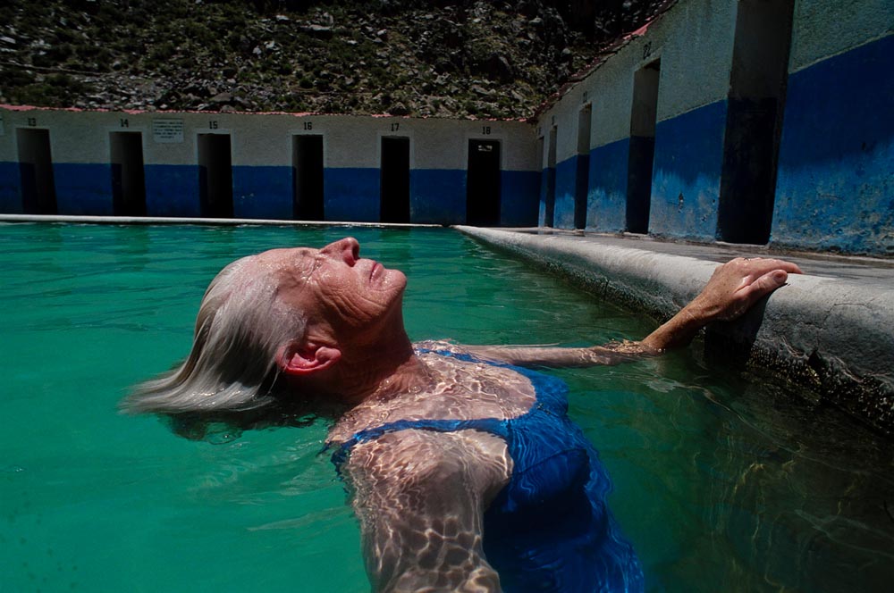 Sister Patricia relaxes in a pool built over a natural hot spring in Chivay.