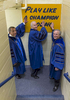 University of Notre Dame president Rev. John Jenkins, C.S.C. and Laetare Medal recipients, John Boehner, former Speaker of the House and Vice President Joe Biden, touch the Play Like A Champion Today sign on their way out of the locker room for the 2016 Commencement Ceremony at Notre Dame Stadium. 