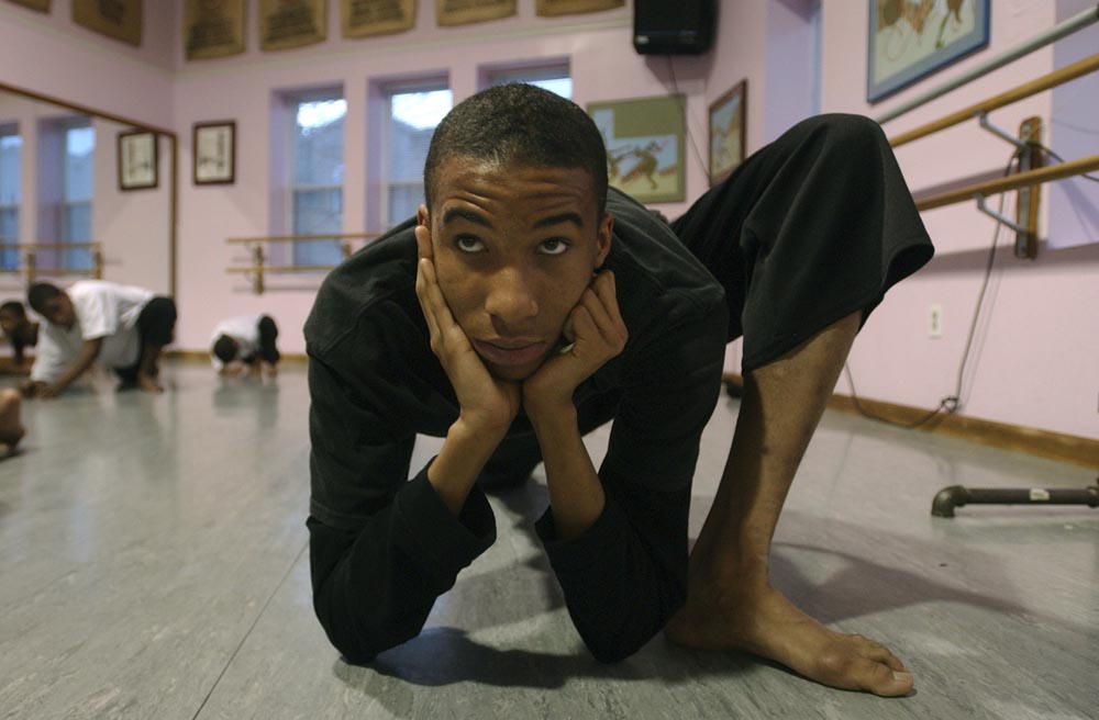 Kareem Goodwin, 16, of S. Philadelphia, stretches before a modern dance class at Point Breeze Performing Arts Center. 