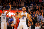Orlando Magic guard Evan Fournier (10) celebrates after hitting a three-point shot to cut the Washington Wizards' lead to three points late in the fourth quarter as the Wizards beat the Magic 105-98 at Amway Center on Thursday October 30, 2014.