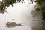 Boats in the early morning mist on a river between Hoi An and My Son, Vietnam. This photo won honorable mention in the International Photography Awards (IPA) 2009. Photo by Jay Graham