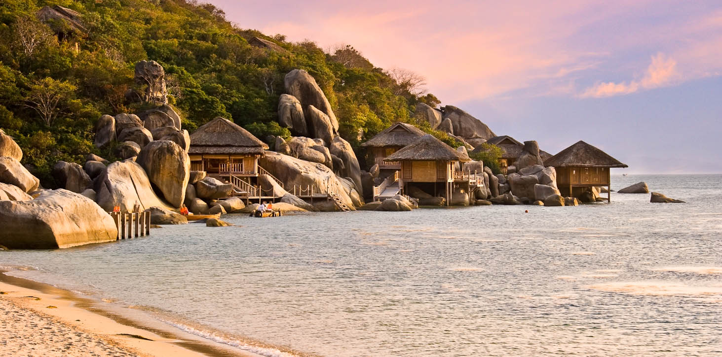 Six Senses Hideaway Ninh Van Bay sits on dramatic Ninh Van Bay, with its impressive rock formations overlooking the South China Sea, white sand beach and towering mountains behind, all adding to the sense of being luxuriously at one with nature. The exclusive property also presents the reality of the destination, with an architectural style reflecting the traditions of Vietnam. Photo by Jay Graham