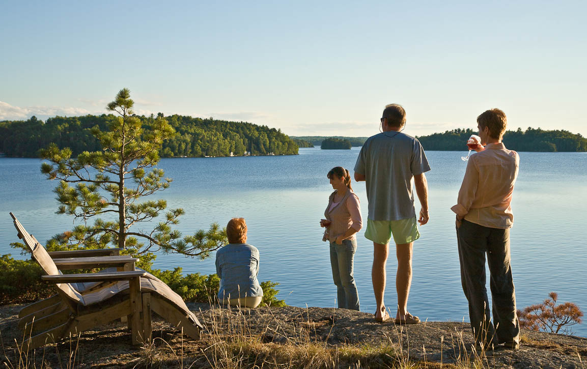 Friends and family enjoying the golden hour on Waters Island in Burntside Lake at the edge of the Boundry Waters in northern Minnesota. Photo by Jay Graham