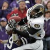 Martin Rucker (top right) of Missouri makes a touchdown reception against Kyle Williams of Kansas State.