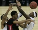 Tremaine Townsend of Northridge (center) is surrounded by Memphis teammates Shawn Taggart (left to right) Robert Dozier during the NCAA Tournament. 