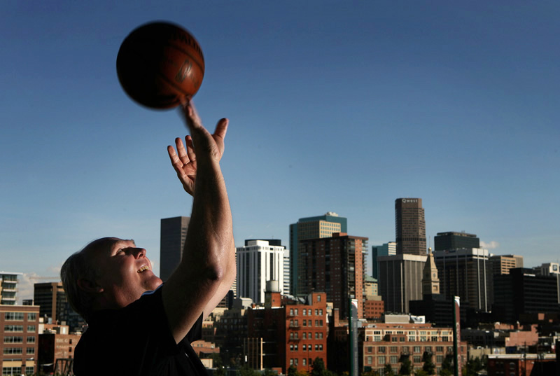 Denver Nuggets head coach, George Karl poses for a portrait with the downtown Denver, Colo. cityscape in the background.  The former player and longtime head coach is trying to improve on his team's performance last year that included a playoff appearance.  Photo by Matt McClain