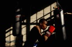 US Navy National team member, Mylin Wyche, 24, of Naval Base Ventura County works out on a heavy bag at Sylva's Boxing Gym in Ventura, Colo.  Photo by Matt McClain